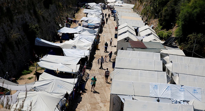 Refugees, migrants stage riots on Greek Chios island, set camp on fire
